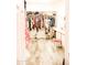 Walk-in closet with custom shelving and hanging racks, providing ample storage space for clothing and accessories at 13686 N 151St Dr, Surprise, AZ 85379