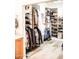 Organized walk-in closet with custom shelving, hanging racks, and a variety of storage solutions at 13686 N 151St Dr, Surprise, AZ 85379