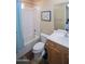 This bathroom features a shower over tub and a single sink vanity with wood finish at 14045 E Geronimo Rd, Scottsdale, AZ 85259