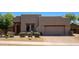 Contemporary home featuring a neutral color palette, a well-maintained front yard, and a two-car garage at 14045 E Geronimo Rd, Scottsdale, AZ 85259