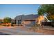 Contemporary home exterior with desert landscaping, a two-car garage, and stucco finish at 14045 E Geronimo Rd, Scottsdale, AZ 85259