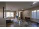 Bright, neutral living room showcasing hardwood floors, large windows with bright shutters and comfortable seating at 14045 E Geronimo Rd, Scottsdale, AZ 85259