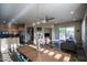 Bright, open-concept living space with stainless steel appliances, and a dining area with a wooden table and chairs at 14045 E Geronimo Rd, Scottsdale, AZ 85259