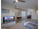 Open-concept living room featuring hardwood floors, a modern sectional sofa, entertainment center, and lots of natural light at 14045 E Geronimo Rd, Scottsdale, AZ 85259