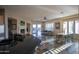 Spacious open-concept living area with sleek countertops, stainless steel appliances, natural light, and open floor plan at 14045 E Geronimo Rd, Scottsdale, AZ 85259