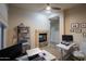 This home office features a cozy fireplace, carpet flooring and a large window for plenty of light at 14045 E Geronimo Rd, Scottsdale, AZ 85259