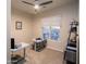 This bright office space has a ceiling fan, carpet flooring, and a window with a view to the backyard at 14045 E Geronimo Rd, Scottsdale, AZ 85259