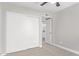 A carpeted bedroom featuring closet with sliding doors at 1408 E Carson Rd, Phoenix, AZ 85042