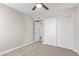 A carpeted bedroom featuring closet with sliding doors at 1408 E Carson Rd, Phoenix, AZ 85042