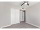 A carpeted bedroom featuring closet with sliding doors at 1408 E Carson Rd, Phoenix, AZ 85042