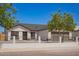 Charming single-Gathering home featuring well-maintained landscaping, a spacious driveway, and a welcoming two-car garage at 1408 E Carson Rd, Phoenix, AZ 85042
