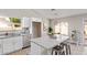 Beautiful white kitchen includes a granite island, stainless steel dishwasher, and ample natural light at 1408 E Carson Rd, Phoenix, AZ 85042