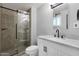 Updated bathroom with a glass-enclosed shower, modern fixtures, and elegant tiling at 14215 N 36Th Way, Phoenix, AZ 85032