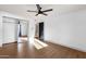 Bedroom with wood-look floors and mirror door closet at 14215 N 36Th Way, Phoenix, AZ 85032