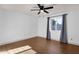 Bedroom featuring wood-look flooring, a window with curtains, and neutral decor at 14215 N 36Th Way, Phoenix, AZ 85032