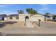 Charming single-story home with desert landscaping and a unique arched entryway at 14215 N 36Th Way, Phoenix, AZ 85032