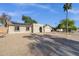 Charming single-story home with desert landscaping, solar panels, and a unique arched entryway at 14215 N 36Th Way, Phoenix, AZ 85032