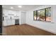 Bright kitchen with white cabinets, stainless steel appliances, and a view of the outdoors at 14215 N 36Th Way, Phoenix, AZ 85032