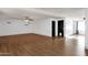 Large room with modern laminate flooring, recessed lighting, and contemporary accents at 14215 N 36Th Way, Phoenix, AZ 85032