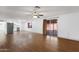 Bright, open living area with wood-look flooring, kitchen access, and backyard access at 14215 N 36Th Way, Phoenix, AZ 85032