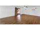 Spacious room with modern laminate flooring, recessed lighting, and a sliding glass door at 14215 N 36Th Way, Phoenix, AZ 85032