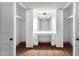 Bright dressing area with white cabinets, mirrors, and vanity at 14215 N 36Th Way, Phoenix, AZ 85032