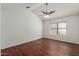Bedroom featuring wood flooring, vaulted ceiling, and a window with natural light at 1425 E Commerce Ave, Gilbert, AZ 85234