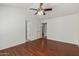 Bedroom with wood flooring, vaulted ceiling, and doorways leading to other parts of the home at 1425 E Commerce Ave, Gilbert, AZ 85234