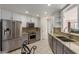 Modern kitchen with stainless steel appliances, granite countertops, and ample cabinet space at 1425 E Commerce Ave, Gilbert, AZ 85234