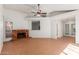 Inviting living room with a cozy brick fireplace and tile flooring at 1425 E Commerce Ave, Gilbert, AZ 85234