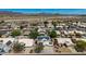 An aerial view of homes in a suburban neighborhood with solar panels on many rooftops at 1631 N Avoca --, Mesa, AZ 85207