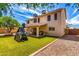 Spacious backyard featuring artificial turf, a playset, and a covered patio for outdoor entertaining at 1631 N Avoca --, Mesa, AZ 85207