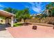 Enjoy a backyard with mature fruit trees, a rock area, pavers, and a covered patio at 1631 N Avoca --, Mesa, AZ 85207