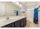 Bathroom featuring dual vanity, a bathtub, and tile flooring at 1631 N Avoca --, Mesa, AZ 85207