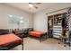 Bright bedroom featuring two beds, natural light, and a ceiling fan at 1631 N Avoca --, Mesa, AZ 85207