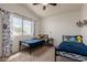 Bedroom with two beds, ceiling fan, and plenty of natural light at 1631 N Avoca --, Mesa, AZ 85207