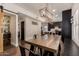 Open floor plan dining area with view to kitchen and decorated brick wall at 1631 N Avoca --, Mesa, AZ 85207