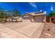 Exterior features a spacious three-car driveway and solar panels on the roof at 1631 N Avoca --, Mesa, AZ 85207
