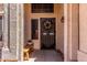Inviting front entrance features a wood bench and decorative wreath on a secure door at 1631 N Avoca --, Mesa, AZ 85207