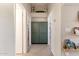 Hallway with decorative shelving, storage cabinet, and gray carpet at 1631 N Avoca --, Mesa, AZ 85207