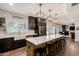 Stylish kitchen with an oversized island with bar seating, with views to living room and dining areas at 1631 N Avoca --, Mesa, AZ 85207