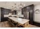 Large open kitchen featuring an oversized island with bar seating, and stainless appliances at 1631 N Avoca --, Mesa, AZ 85207