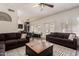 Spacious living room with abundant seating, a decorative fireplace, and view to the backyard at 1631 N Avoca --, Mesa, AZ 85207