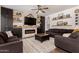Comfortable living room features a fireplace, built in storage, and floating shelves at 1631 N Avoca --, Mesa, AZ 85207