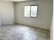 Bright bedroom with tile flooring, natural light, and a neutral color palette at 2220 W Dora St # 220, Mesa, AZ 85201