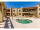 Exterior view of a small hot tub and surrounding residential building at 2220 W Dora St # 220, Mesa, AZ 85201