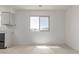 Bright kitchen view with neutral tile flooring extending from the living room and a window allowing natural light at 2220 W Dora St # 220, Mesa, AZ 85201
