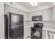 Modern kitchen featuring stainless steel appliances, marble countertops, and white cabinets at 2220 W Dora St # 220, Mesa, AZ 85201