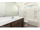 Bathroom features tile flooring, vanity, sink, shower, and toilet at 25221 N 131St Dr, Peoria, AZ 85383