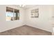 Bright dining room with large windows, hardwood floors, and modern lighting at 25221 N 131St Dr, Peoria, AZ 85383